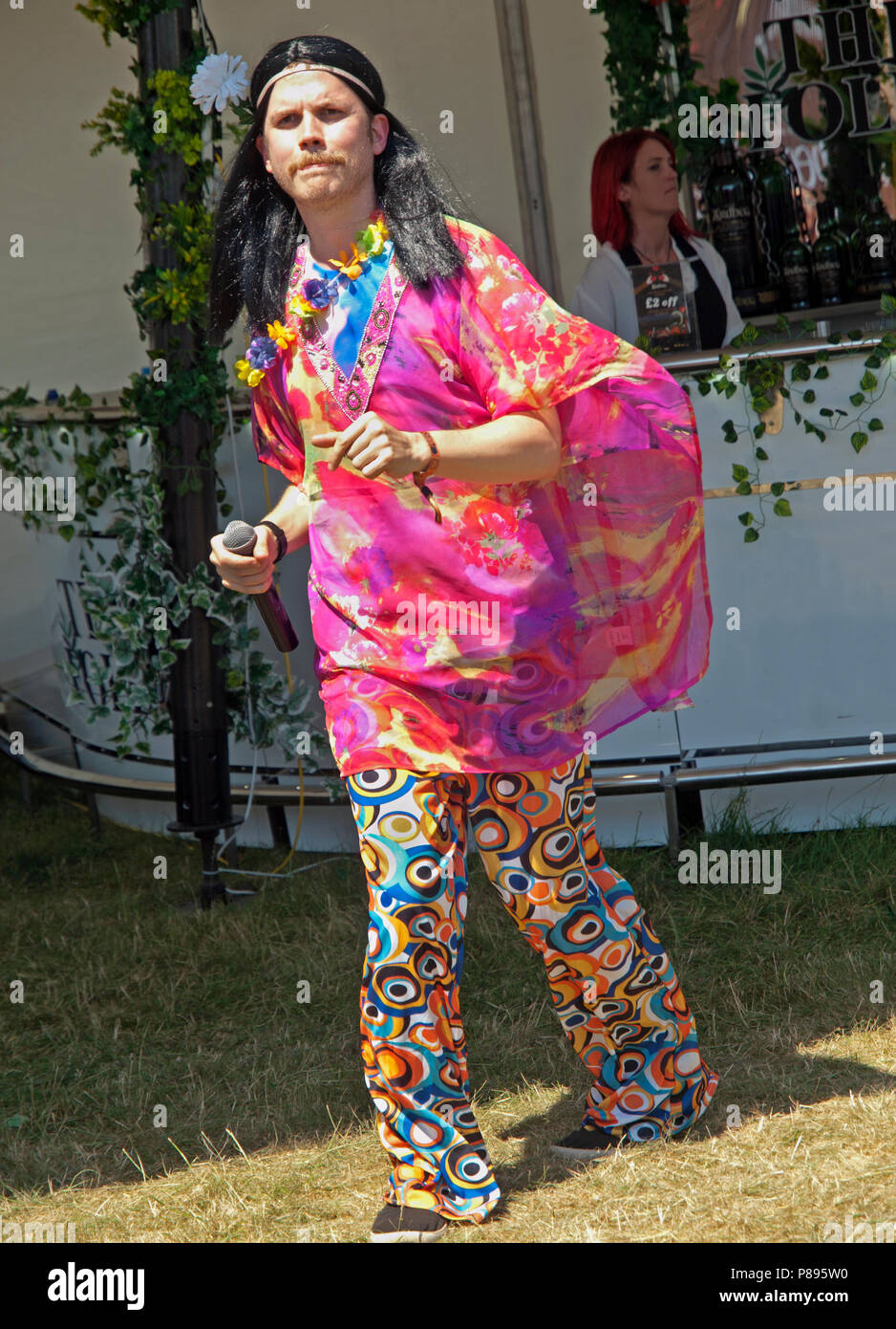 Dressed in hippy clothes a man enjoys himself at Love Supreme