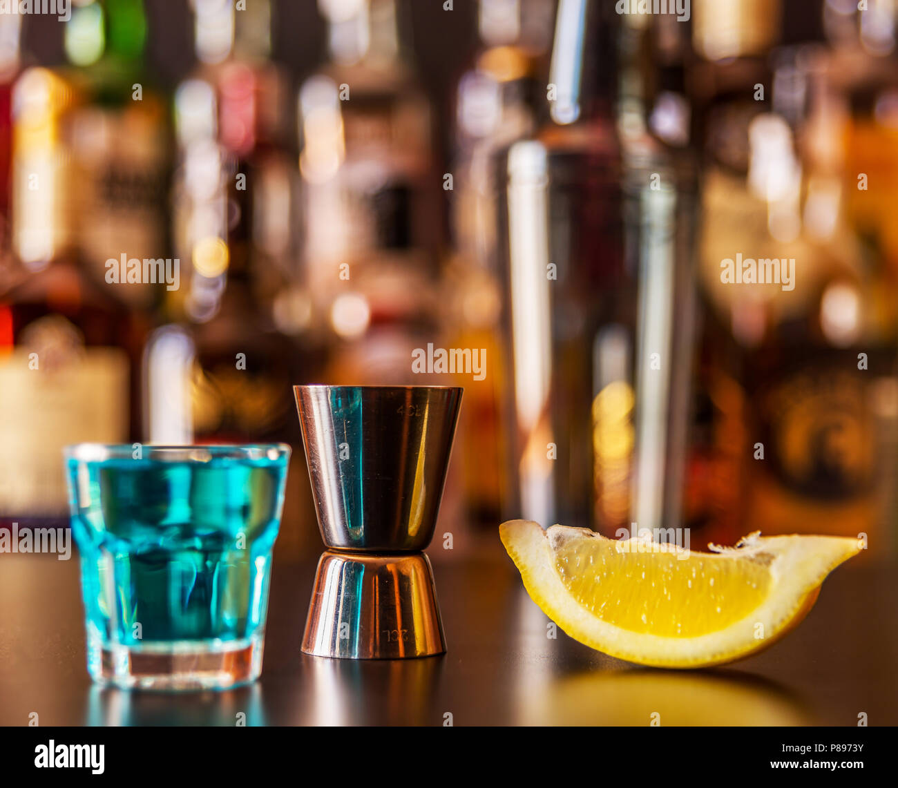 Popular blue drink shot kamikaze on the background of the bar with ...