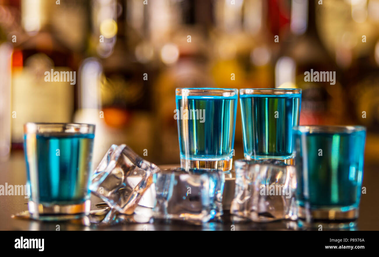 Popular blue drink shot kamikaze on the background of the bar with ...