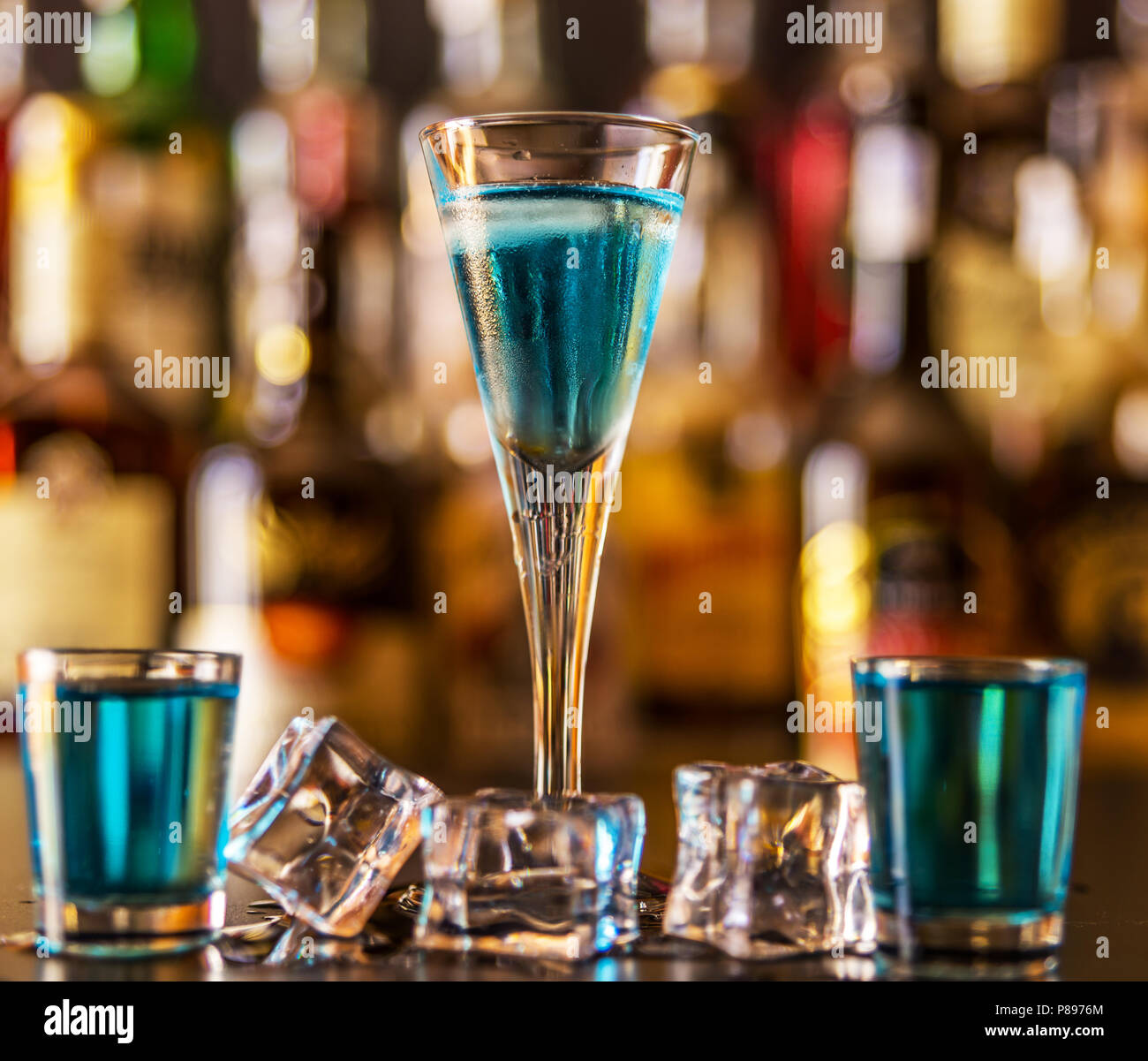 Popular blue drink shot kamikaze on the background of the bar with ...