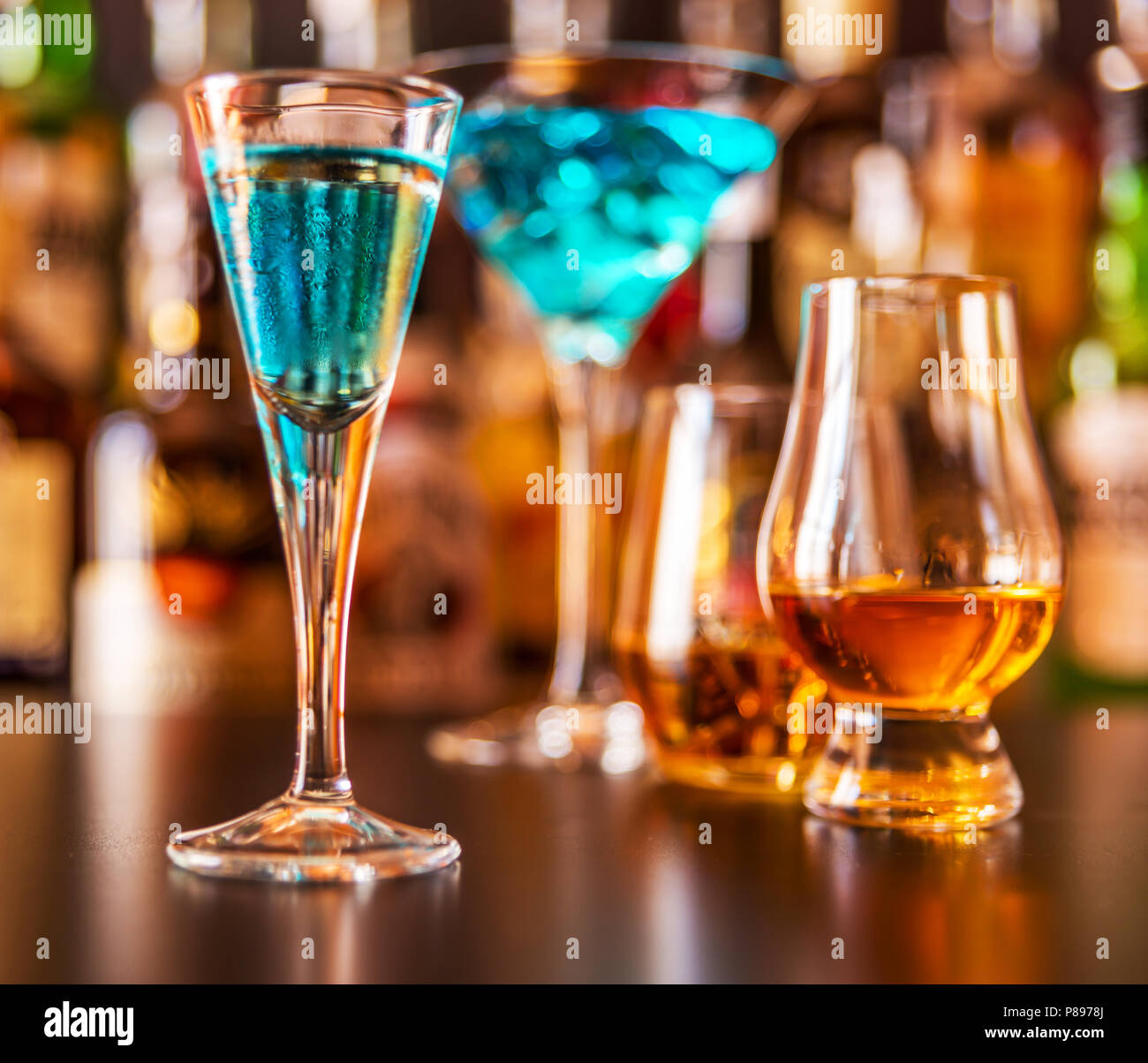 Scottish whisky in a glass with ice cubes, golden color whiskey