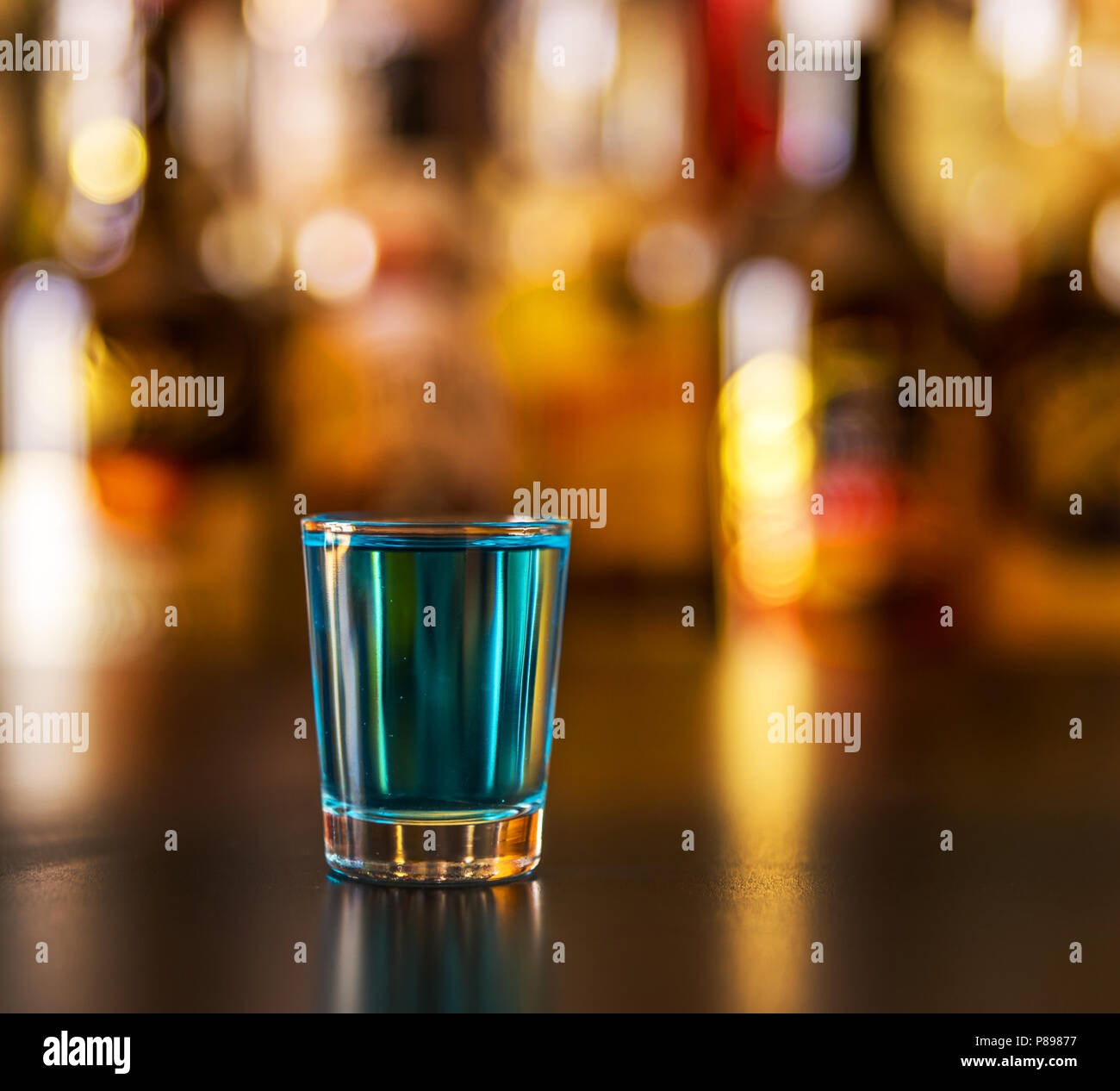 Popular blue drink shot kamikaze on the background of the bar with ...