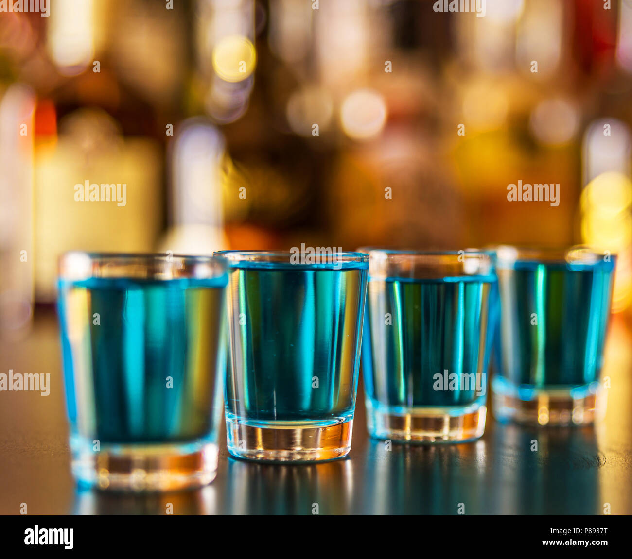Popular blue drink shot kamikaze on the background of the bar with ...