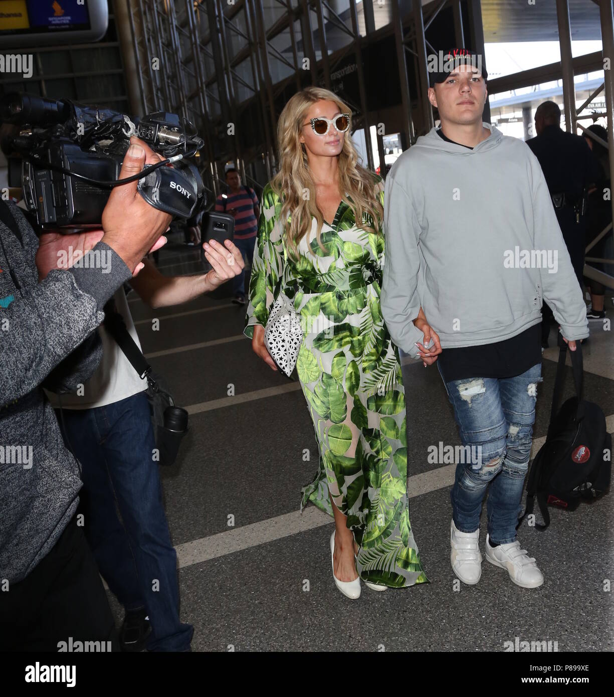 Paris Hilton and fiance Chris Zylka depart from the airport Featuring