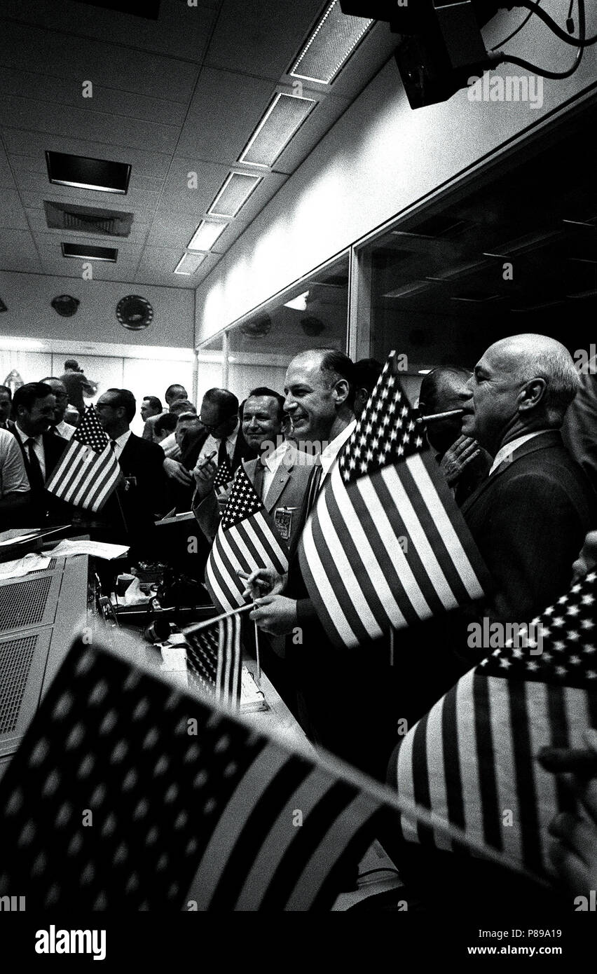 NASA and Manned Spacecraft Center officials join w flight controllers in the Mission Operations Control Room in celebrating the successful conclusion of the Apollo 11 lunar landing mission Stock Photo