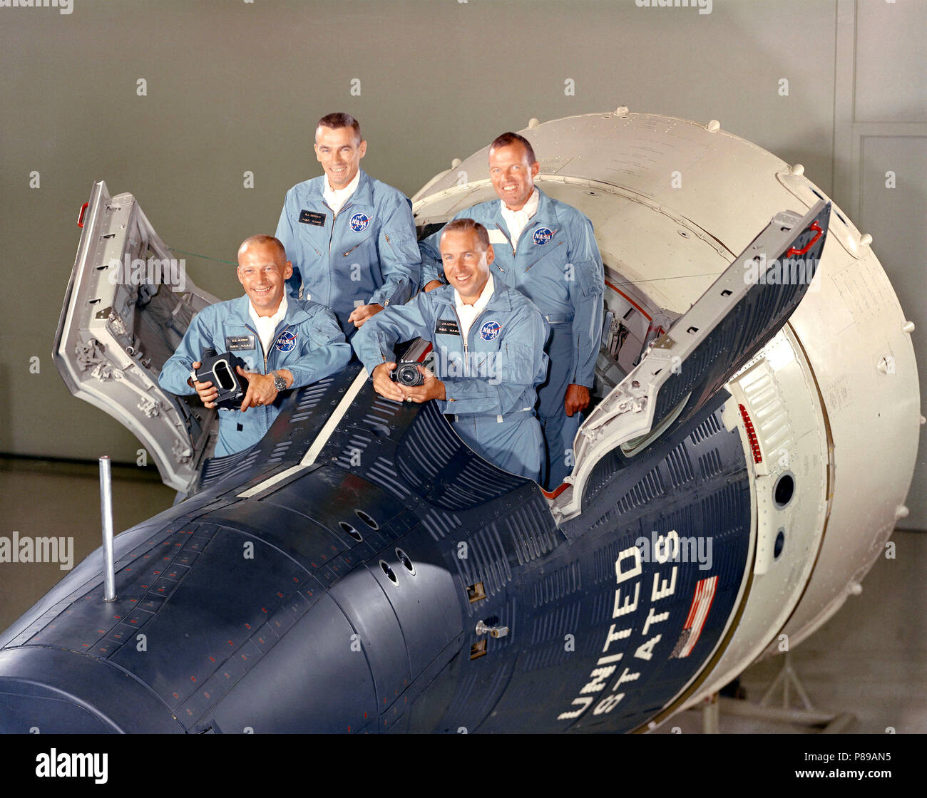 The Gemini-12 prime crew (in front)  James A. Lovell Jr. (R), and Edwin E. Aldrin Jr. (L), In the rear is the Gemini-12 backup crewL. Gordon Cooper Jr., (R) and Eugene A. Cernan Stock Photo