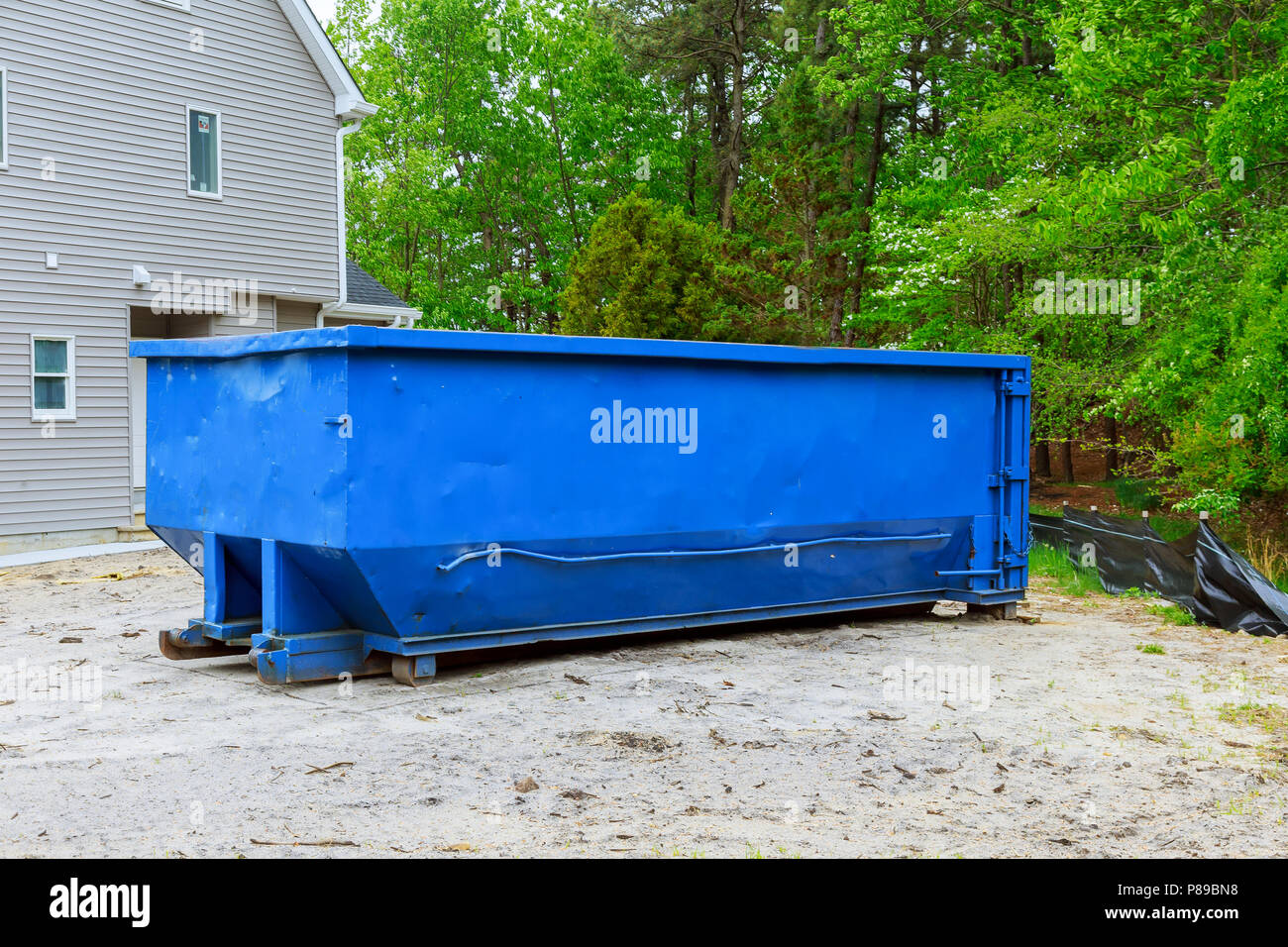 Full construction rubbish bin with loads at construction site waste