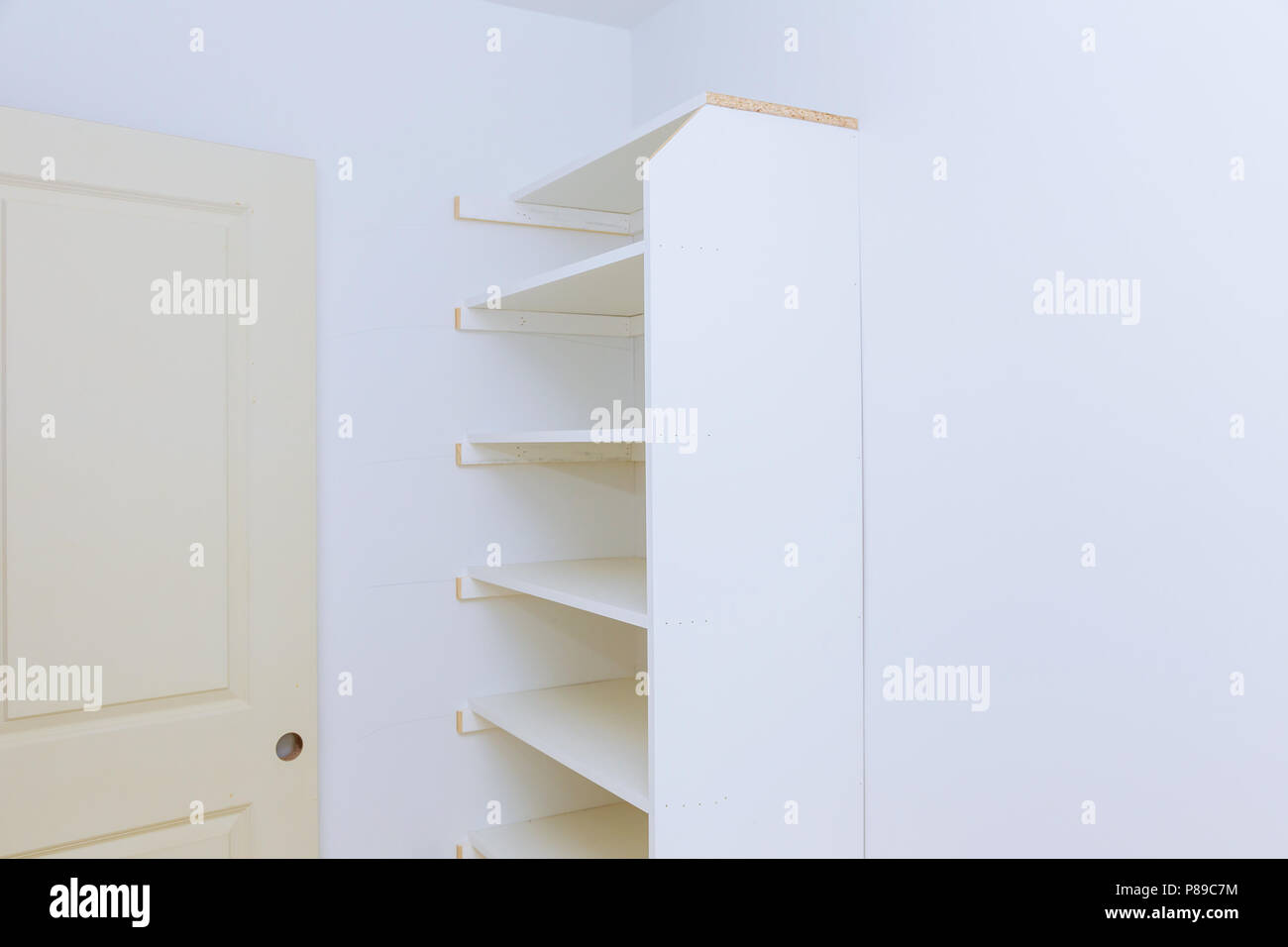 installation of shelves with a shelf near of big Furniture