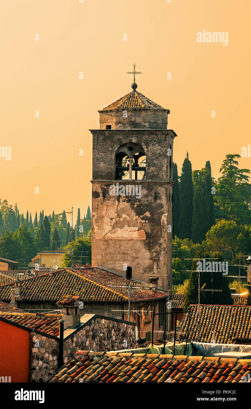 The old bell tower in the Italian town of Sirmione at sunset Stock Photo -  Alamy