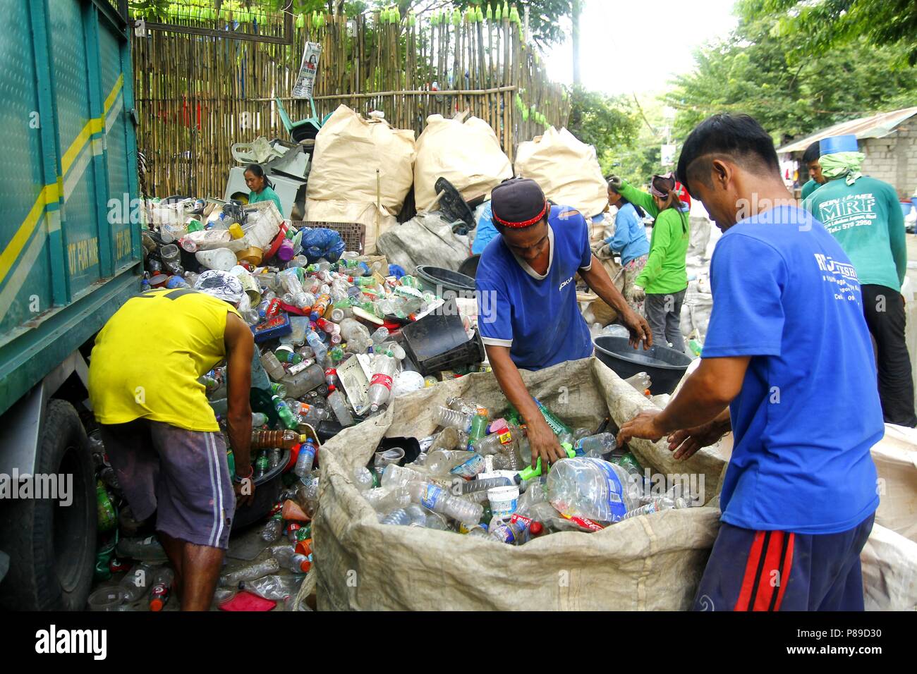 ANGONO, RIZAL, PHILIPPINES JULY 4 2018 Workers of a materials