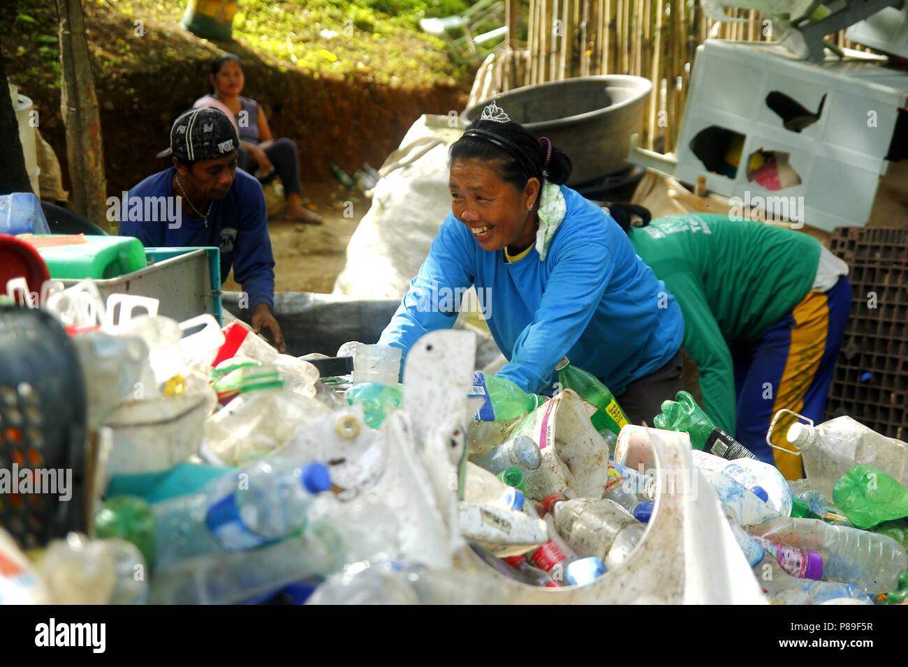 ANGONO, RIZAL, PHILIPPINES JULY 4 2018 Workers of a materials