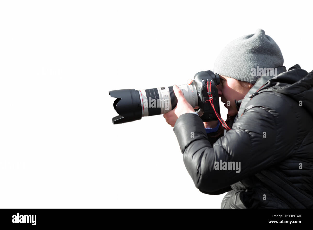 Photographer with professional camera and lens on white background Stock Photo
