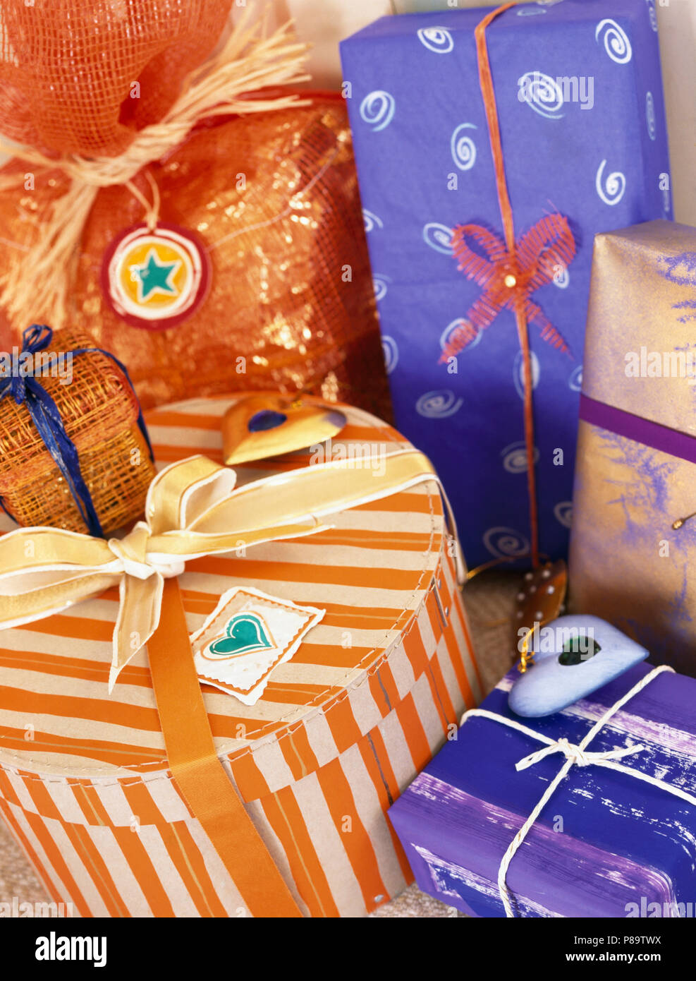 Christmas presents gift wrapped in brightly coloured, hand decorated
