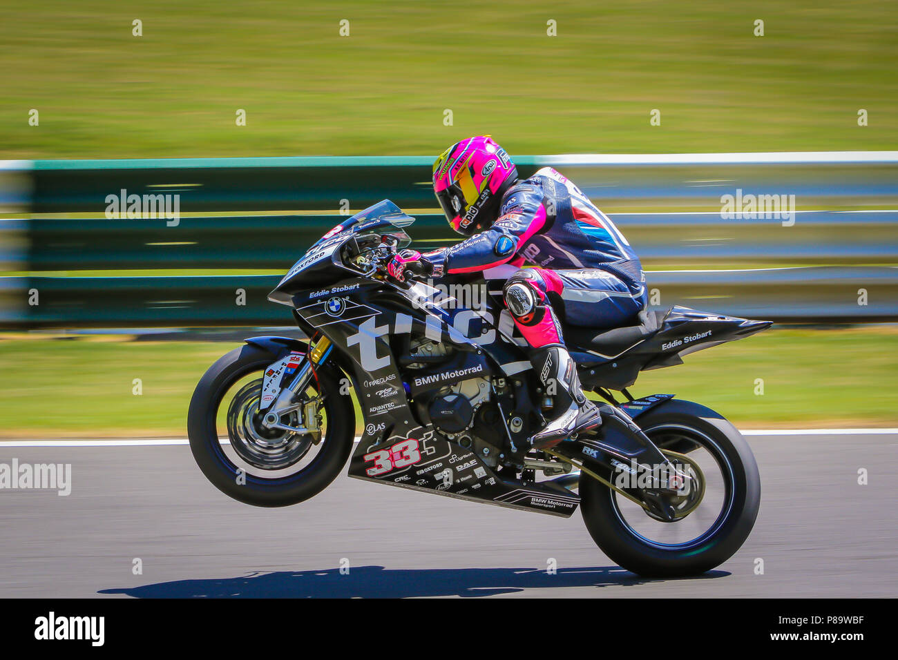 Jumping the mountain at Cadwell Park Stock Photo