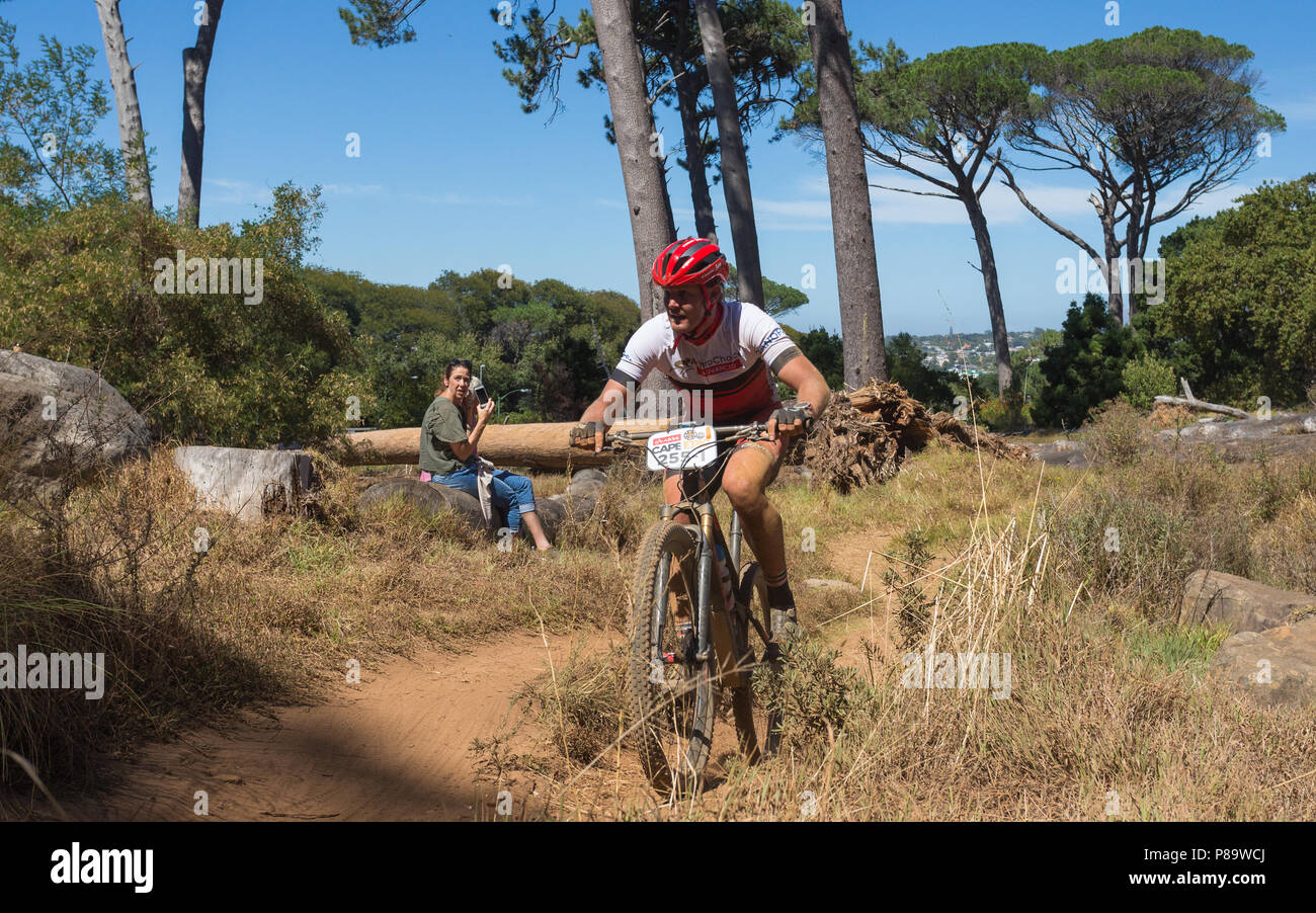 Cape Epic 2018 cyclist on endurance course on slopes of Table mountain, Cape Town, South Africa with spectators Stock Photo