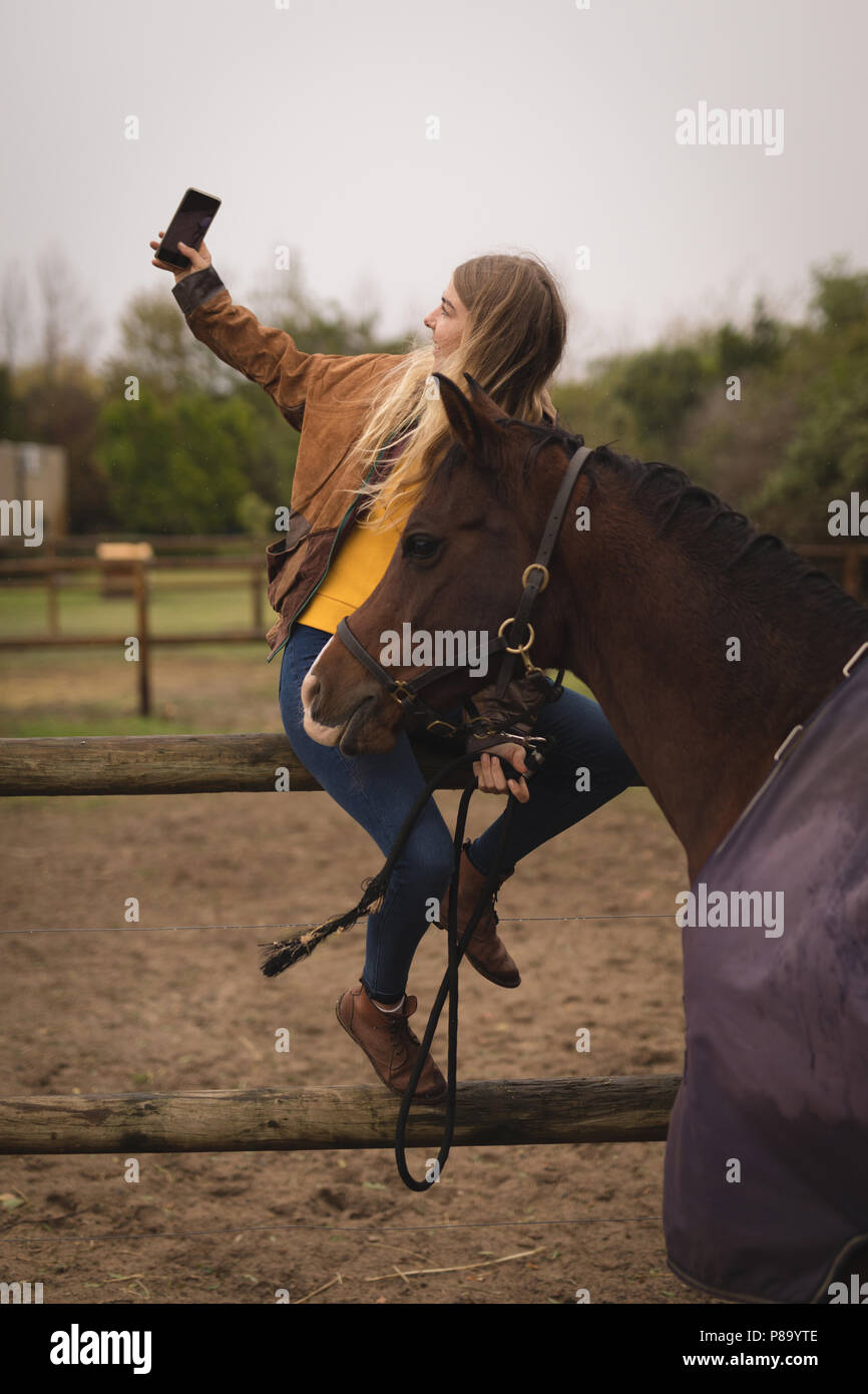 Girl taking selfie with horse in the ranch Stock Photo Alamy