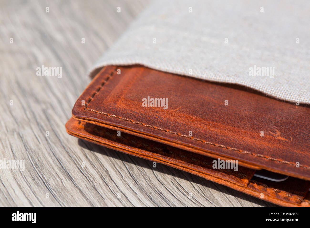 Leather Wallet on wooden table Stock Photo