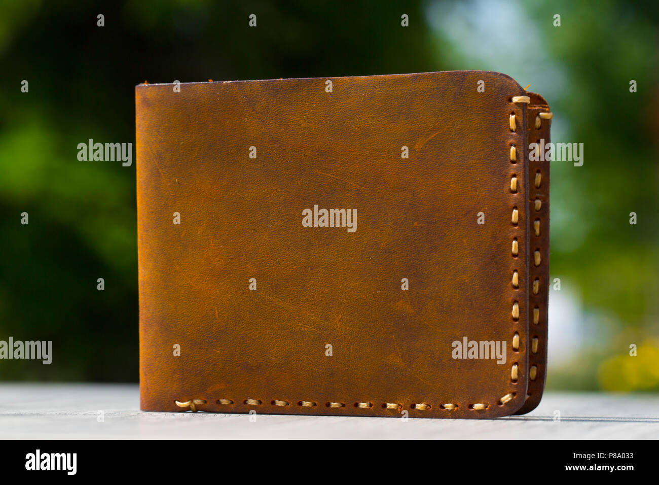 Leather Wallet on wooden table Stock Photo