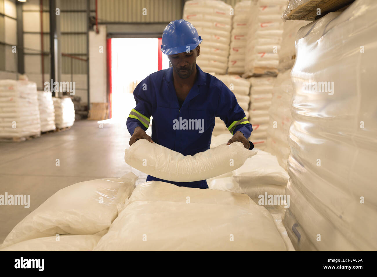 Male worker holding white cement Stock Photo