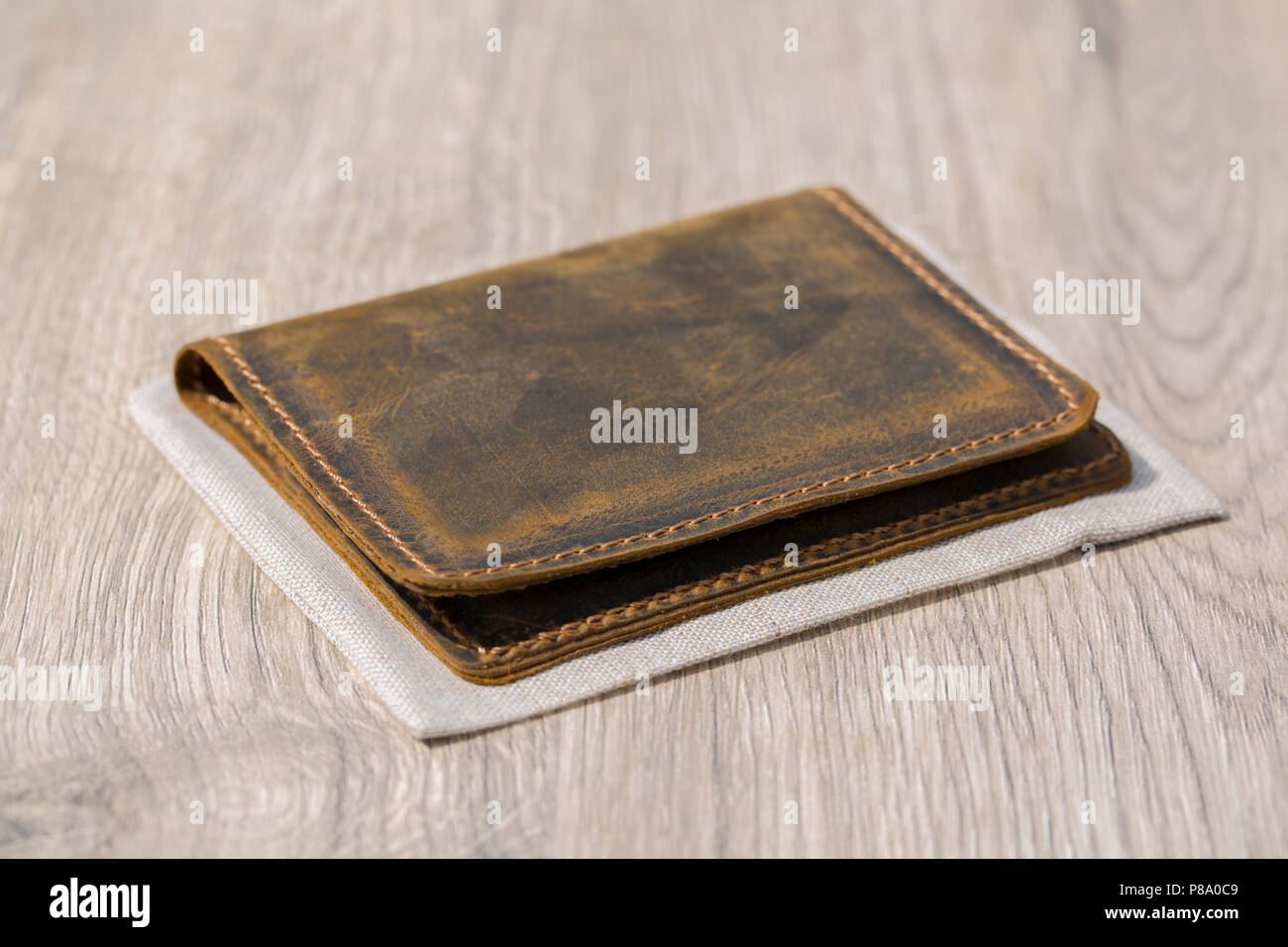 Top view of an old photograph scrapbook album with a tied string