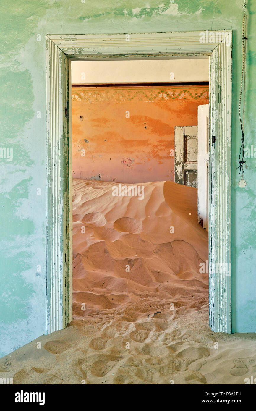 Desert sand in the ruined building of the former diamond city, ghost town, Kolmanskop, Lüderitz, Namibia Stock Photo