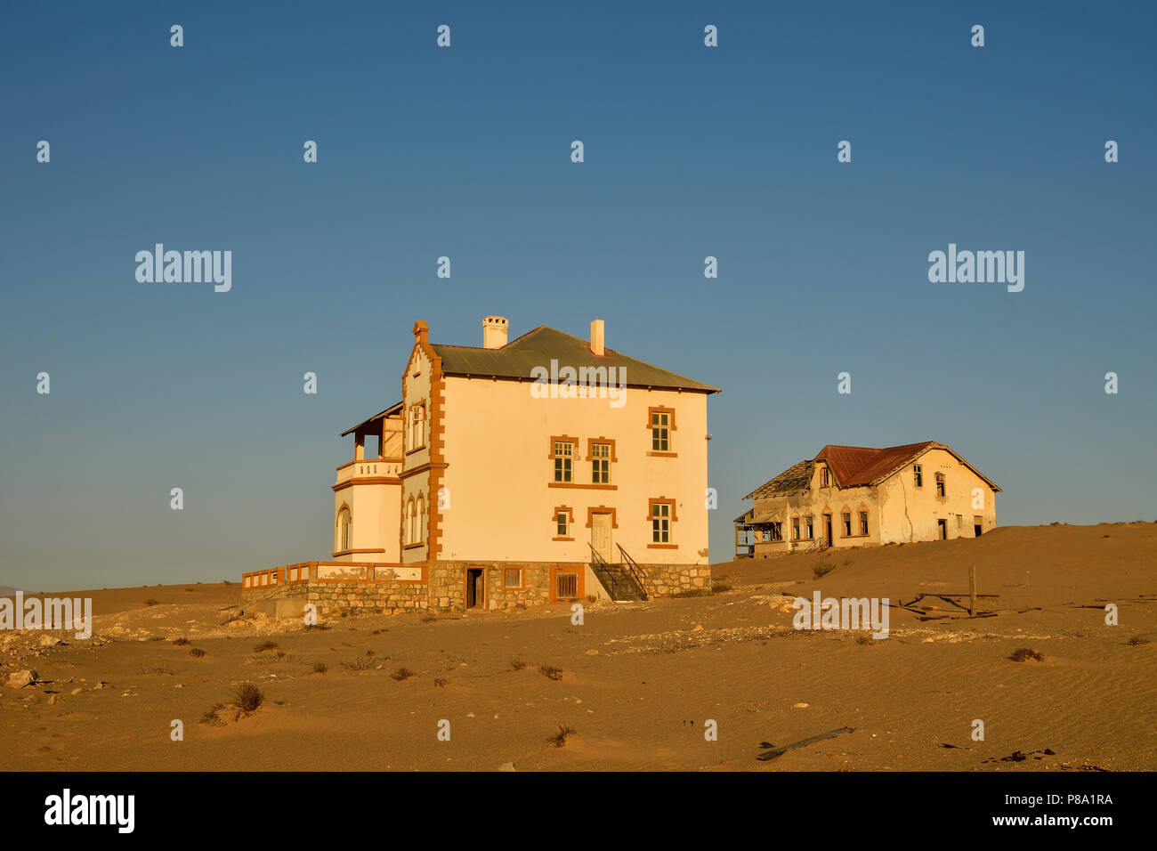 Decaying houses of the accountant and mine manager of the former diamond town Kolmanskop, ghost town, Kolmanskop, Lüderitz Stock Photo