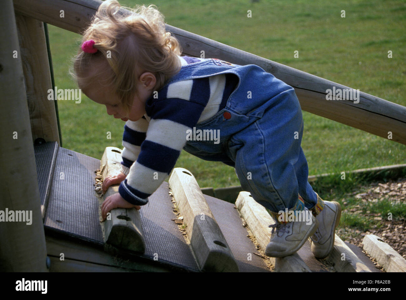 agile toddler climbing apparatus in playground Stock Photo Alamy