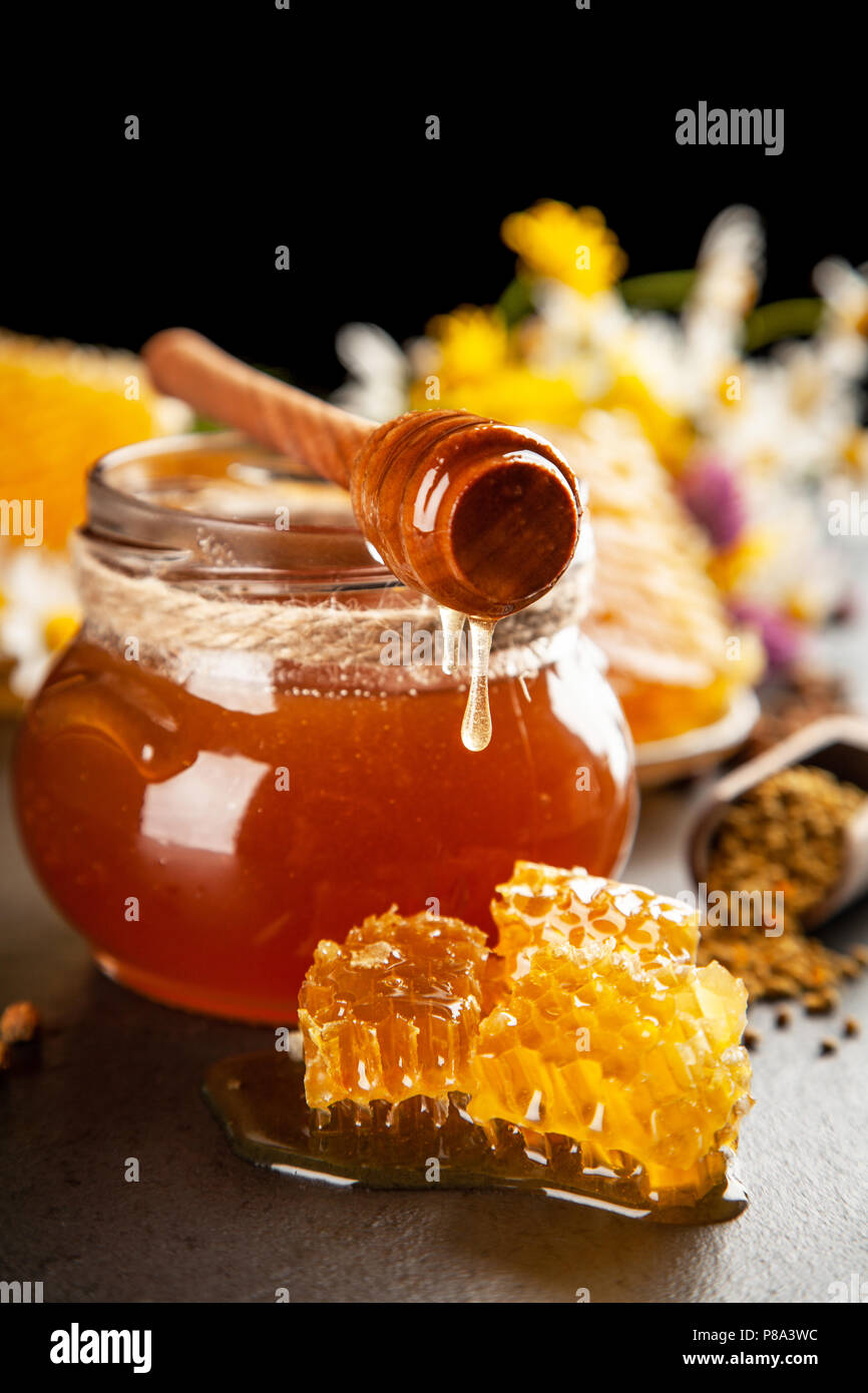 Honey jar and dipper Stock Photo Alamy