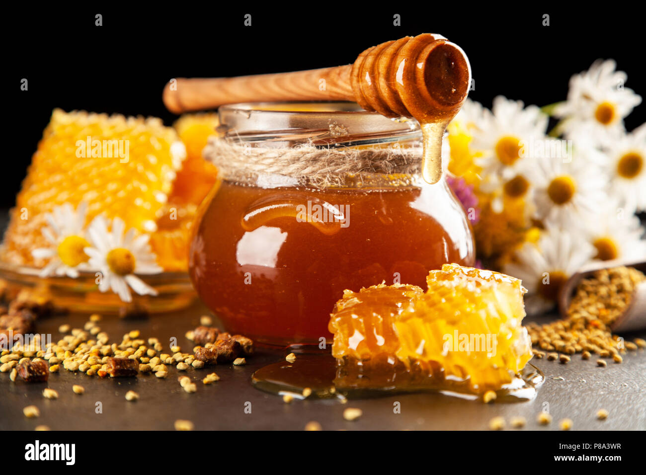 Honey jar and dipper Stock Photo Alamy