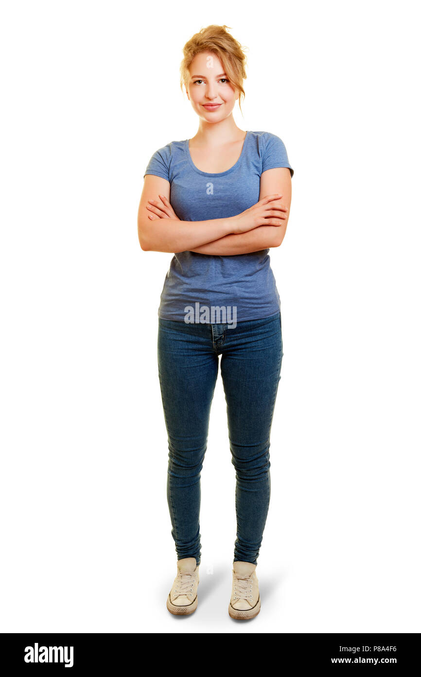 Young woman as full body shot from front with crossed arms Stock