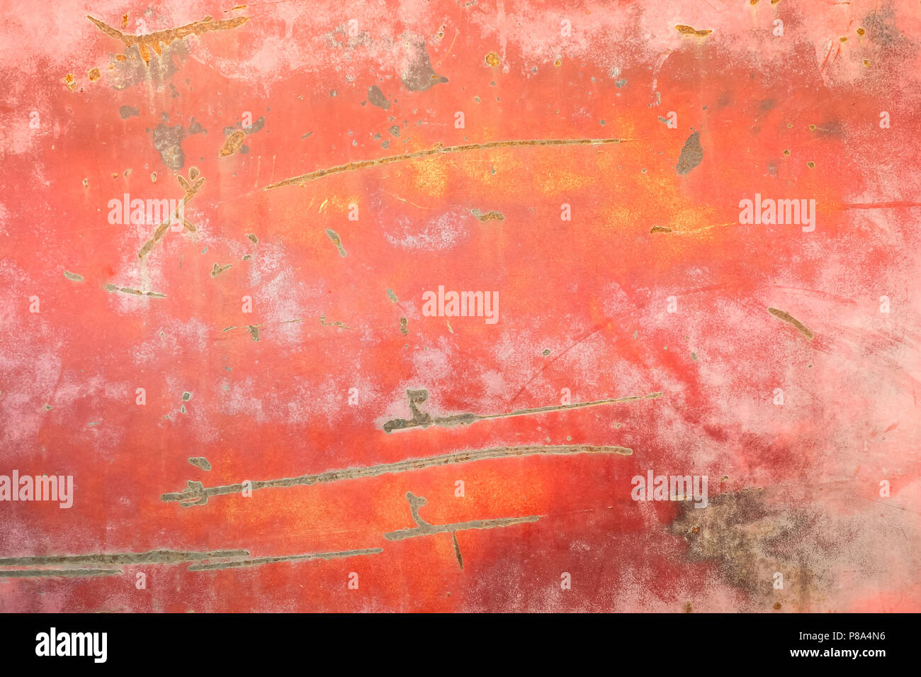 close-up of peeling paintwork and scratches on a rusting metal panel background Stock Photo