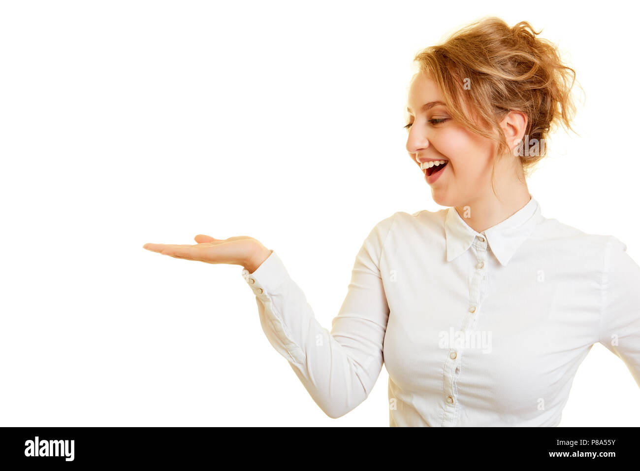 Laughing young blond woman with empty palm for mockup product presentation Stock Photo