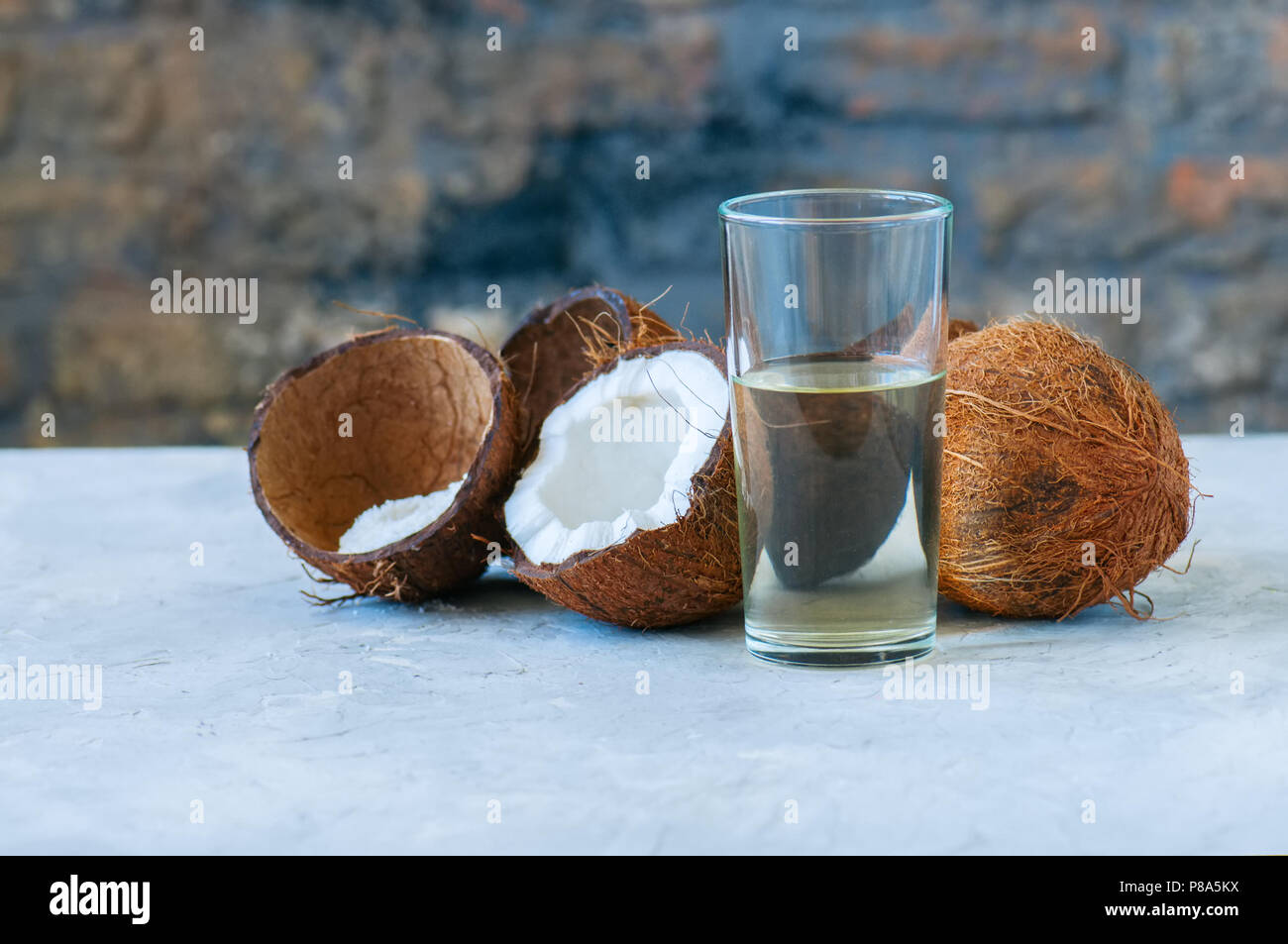 Coconut water, whole coconuts on a white background. Coconut products
