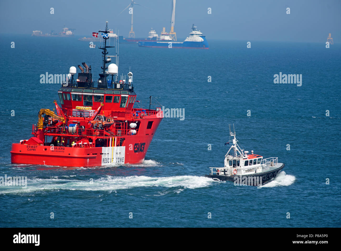 Built In Singapore The Esvagt Capri Makes Its Way Out From Aberdeen Harbour Escorted By The Local Pilot Boat Till 1mile Out Stock Photo Alamy