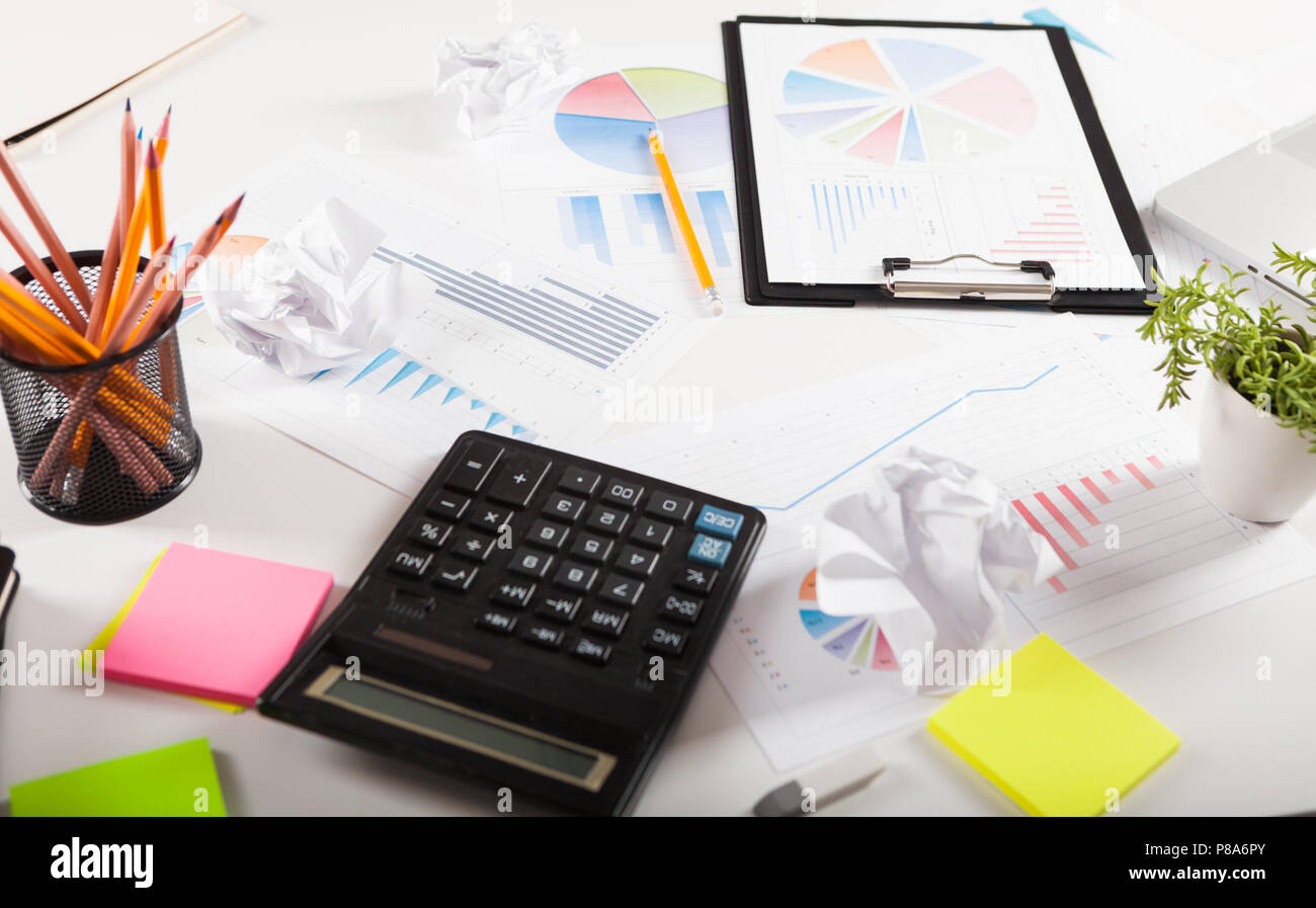 Business Desktop. Photo diagrams graphs and numerals in the table on ...