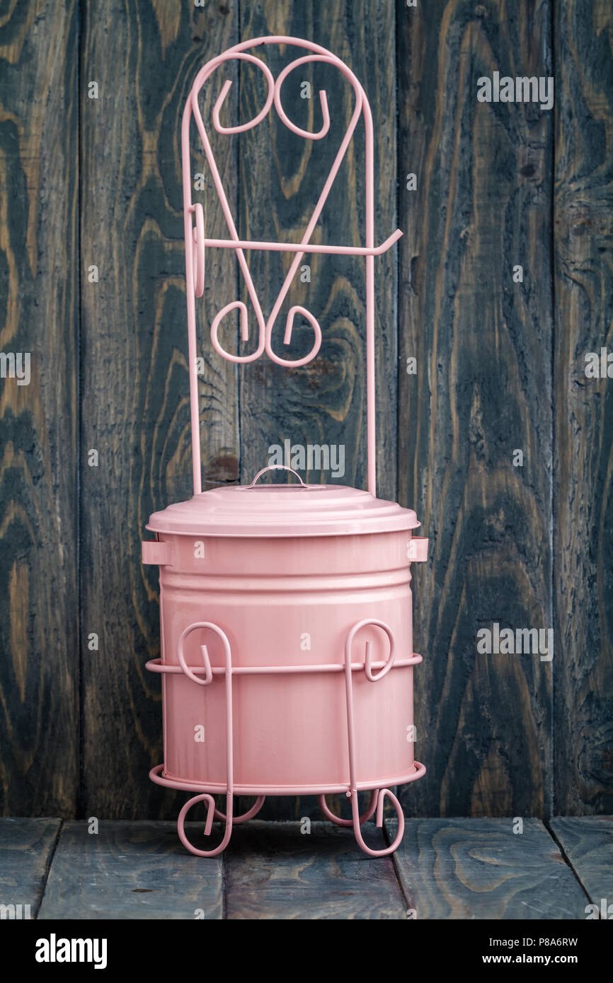 Small pink metal trash box for bathroom Stock Photo