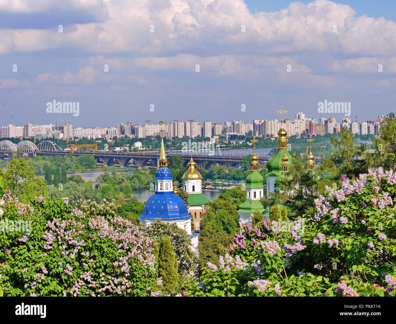 a grandiose urban landscape seen in the distance high-rises in the background of church domes . For your design Stock Photo