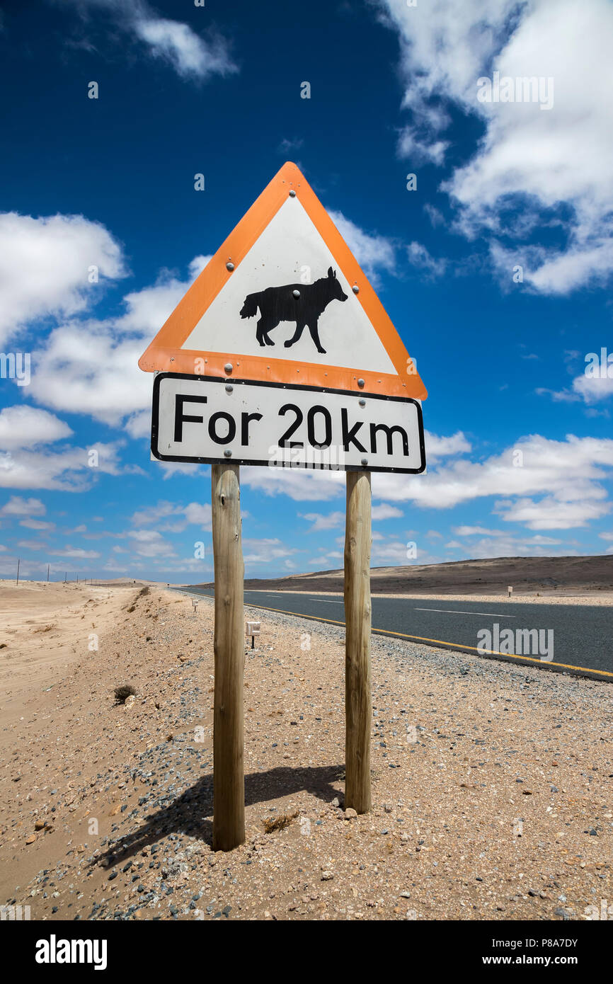 Road sign warning of brown hyaena, Namibia Stock Photo