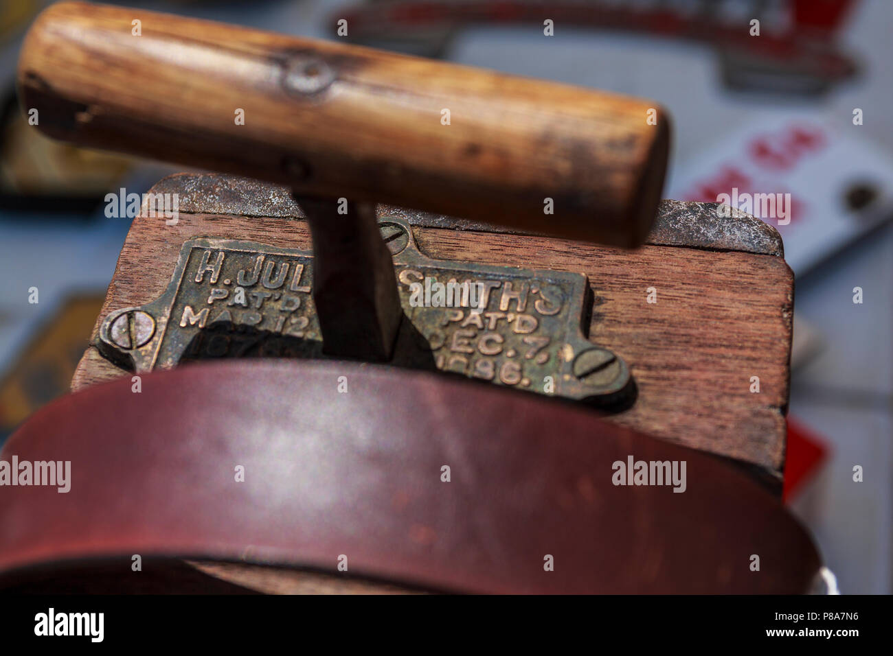 Close-up of the top of an old dynamite blasting machine (detonator) showing plunger and strap. Stock Photo