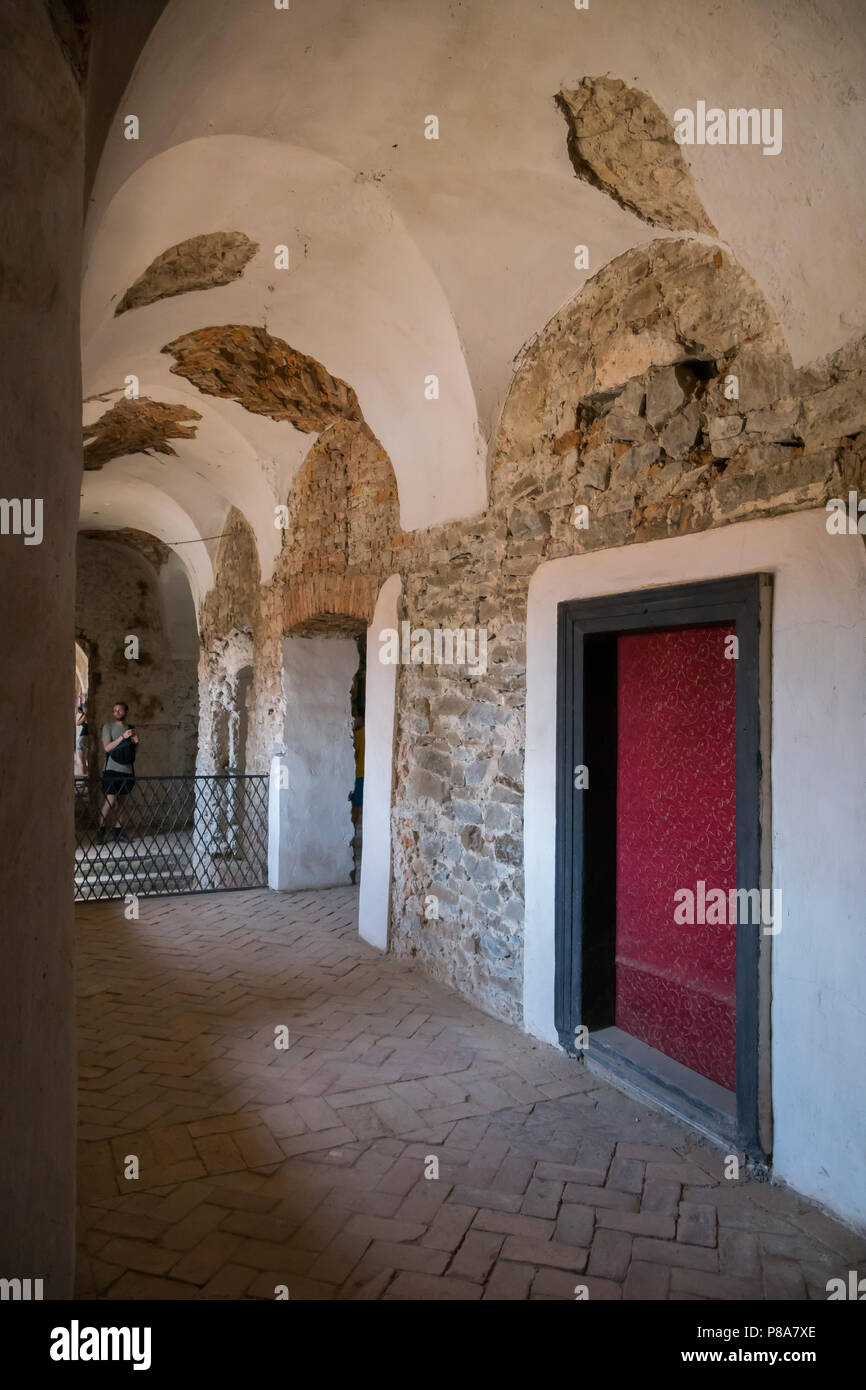 The Door In The Castle Corridor With Thick Walls And Archway