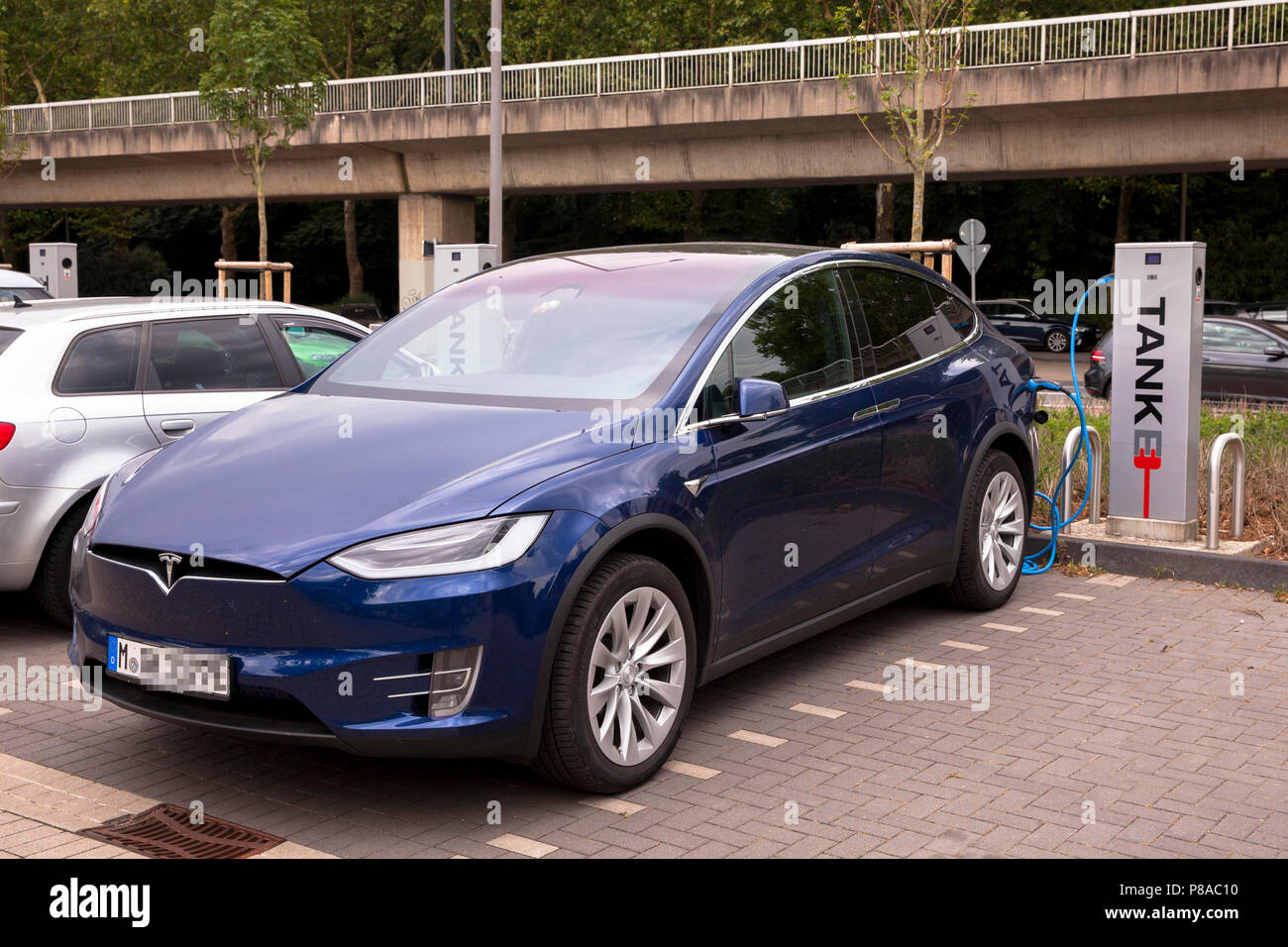 Tesla X at a charging station for electric cars, Cologne, Tesla Modell X an einer Koeln, Deutschland Stock - Alamy