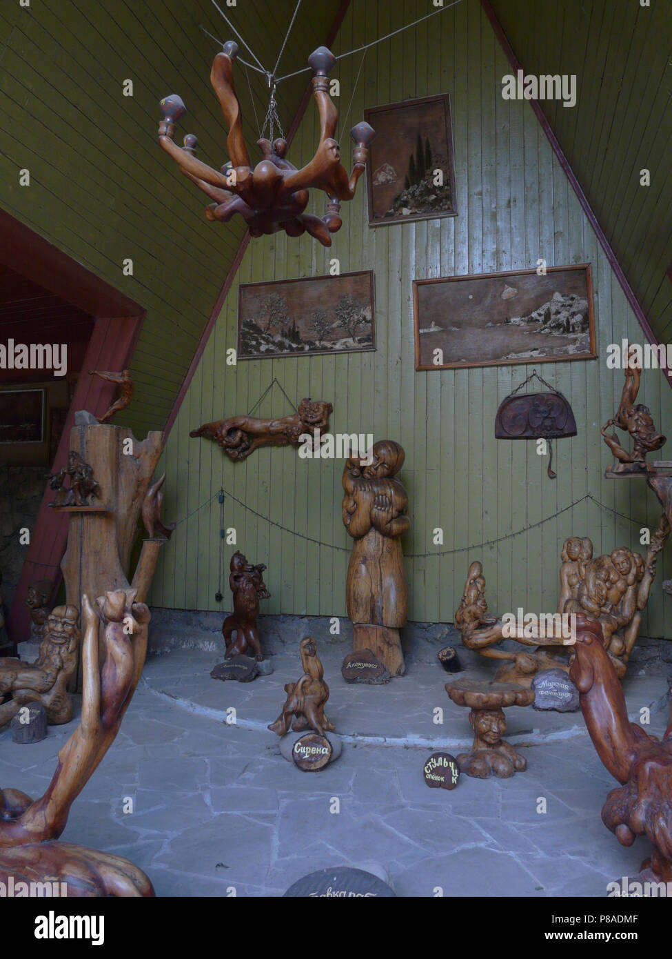Museum eexponies in the form of wooden carved figures of people and animals . For your design Stock Photo