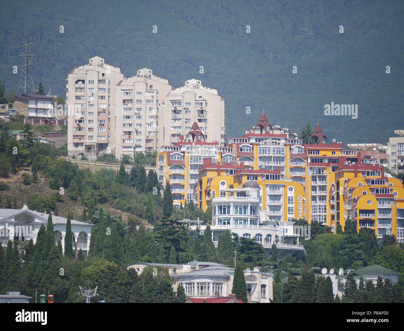 high modern houses and private villas and hotels amidst green trees on the  slope of a forested mountain. place of rest, travel and tourism . For your  Stock Photo - Alamy