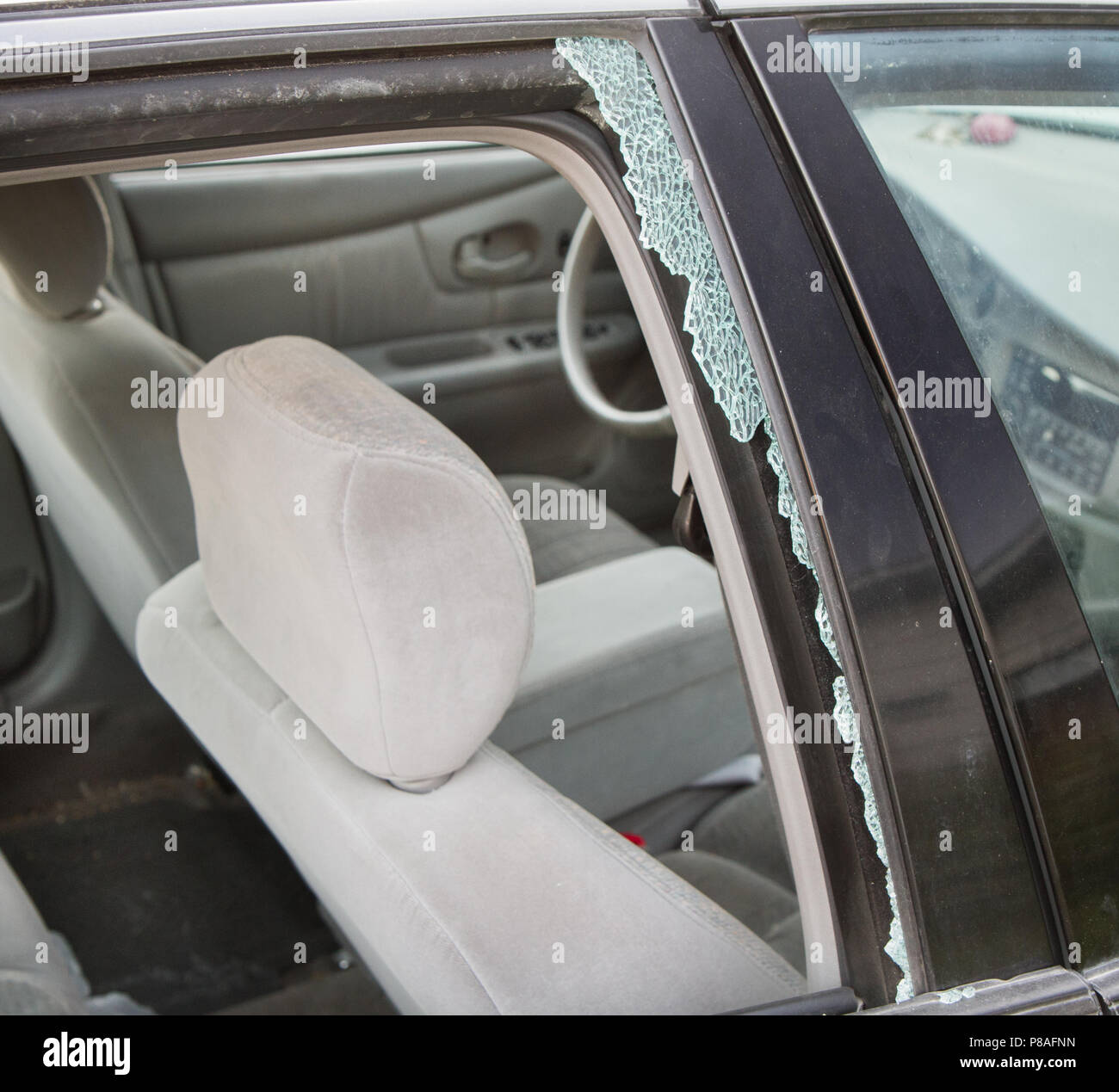Car wreck causing a broken window. Can show auto safety, insurance industry, or even theft and vandalism Stock Photo