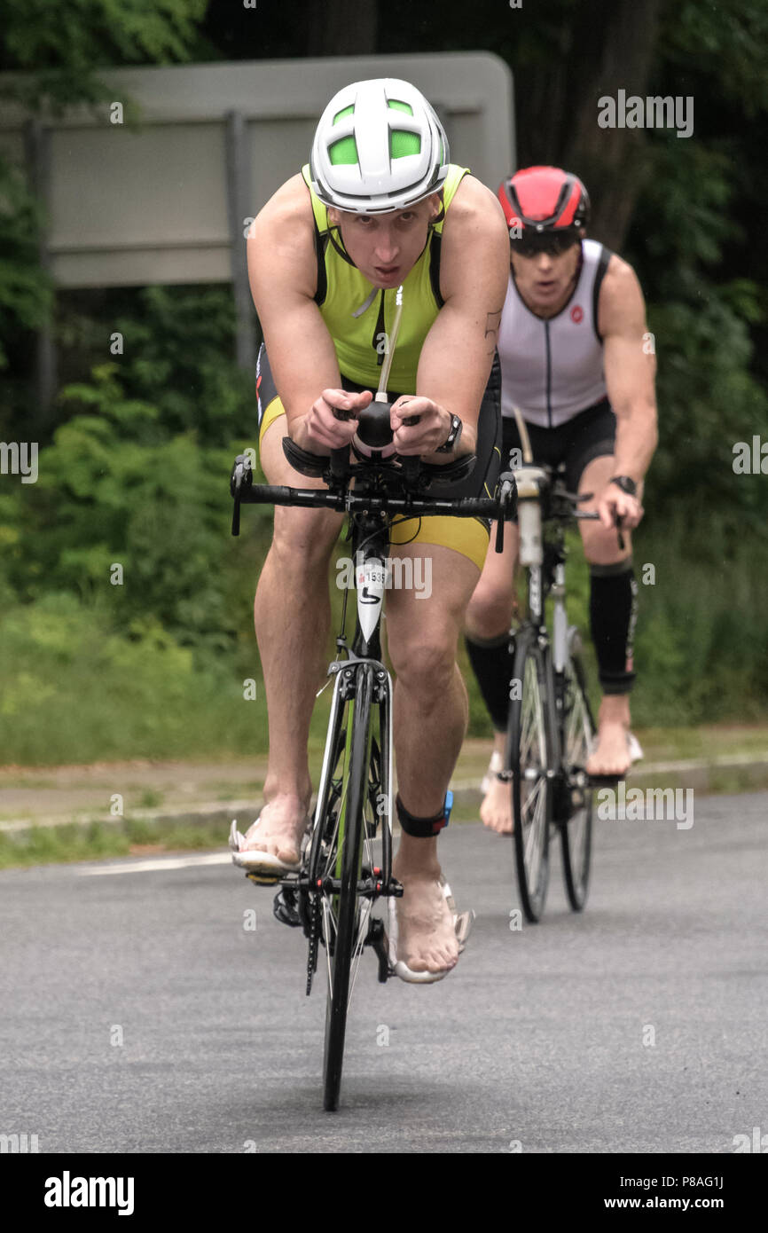 Male competitor in the bike segment in the 2018 Hague Endurance Festival Olympic Triathlon Stock Photo
