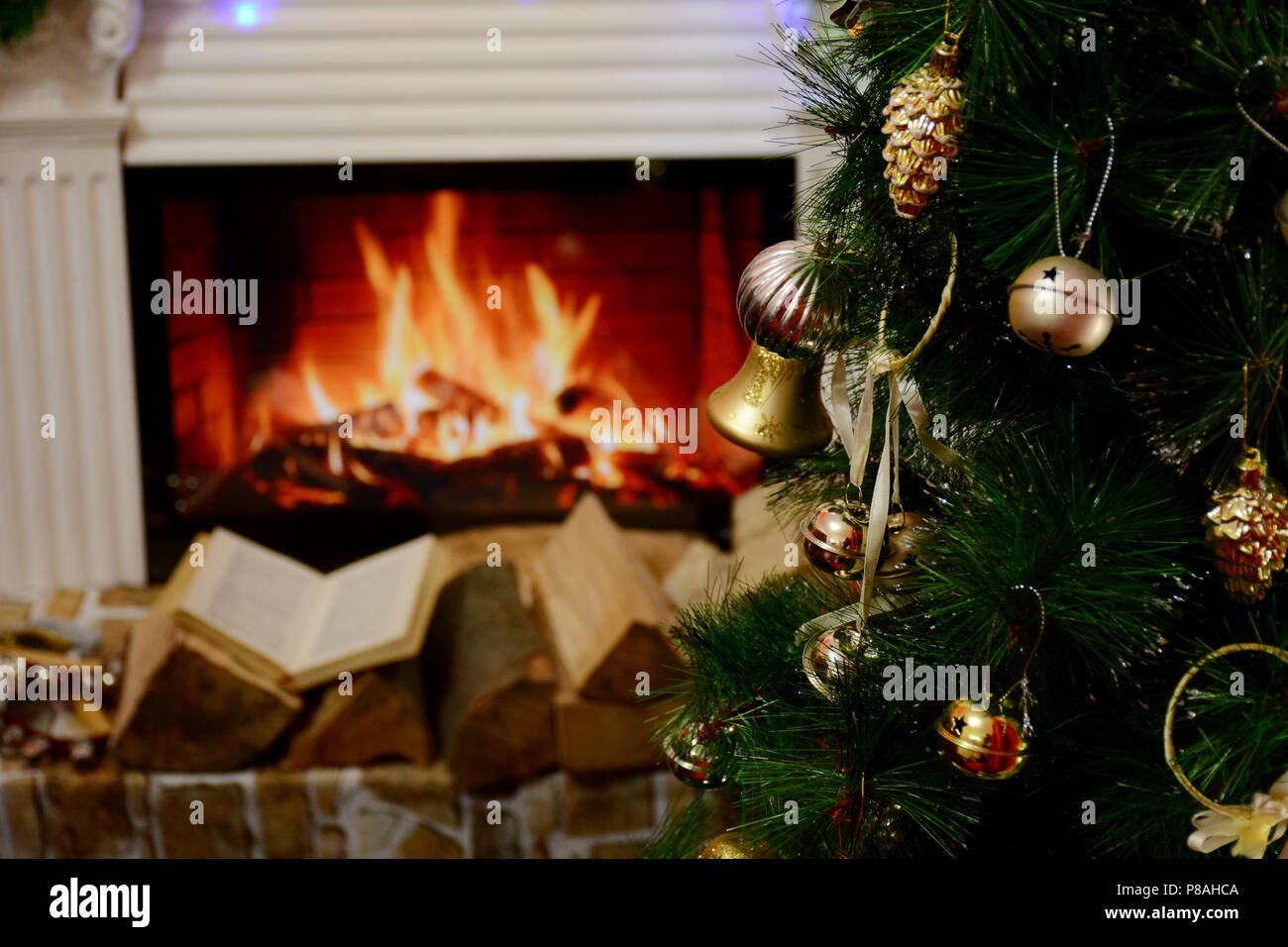 Beautiful Decorated Fireplace And Christmas Tree Book On Wood In