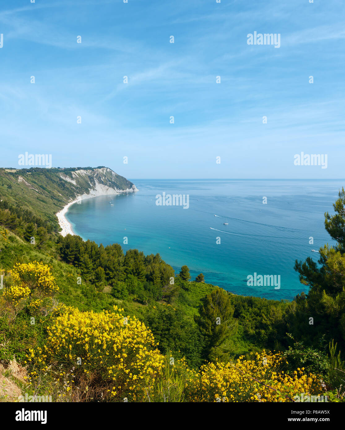 Summer Adriatic sea bay and blossoming Spiaggia Mezzavalle beach near Portonovo and Ancona towns in the Marche region. Italy, Conero Riviera. Stock Photo