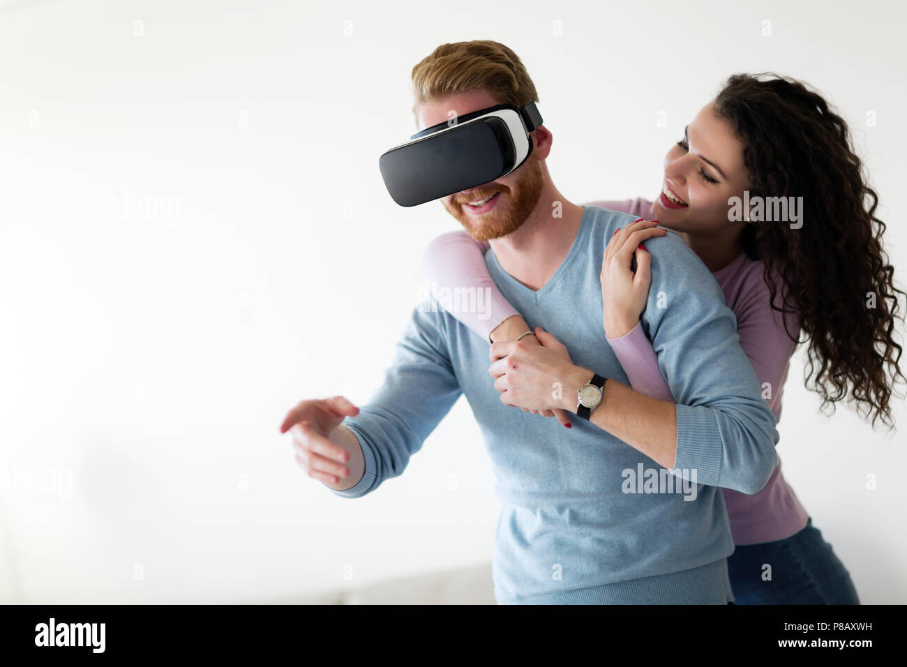 Attractive young couple trying virtual reality headset Stock Photo