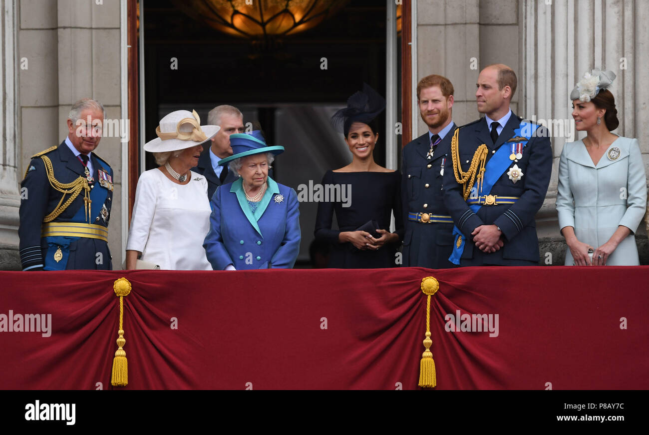 (left to right) The Prince of Wales, Duchess of Cornwall, Queen Elizabeth II, Duchess of Sussex, Duke of Sussex, Duke of Cambridge and Duchess of Cambridge on the balcony at Buckingham, Palace where they watched a Royal Air Force flypast over central London to mark the centenary of the Royal Air Force. Stock Photo