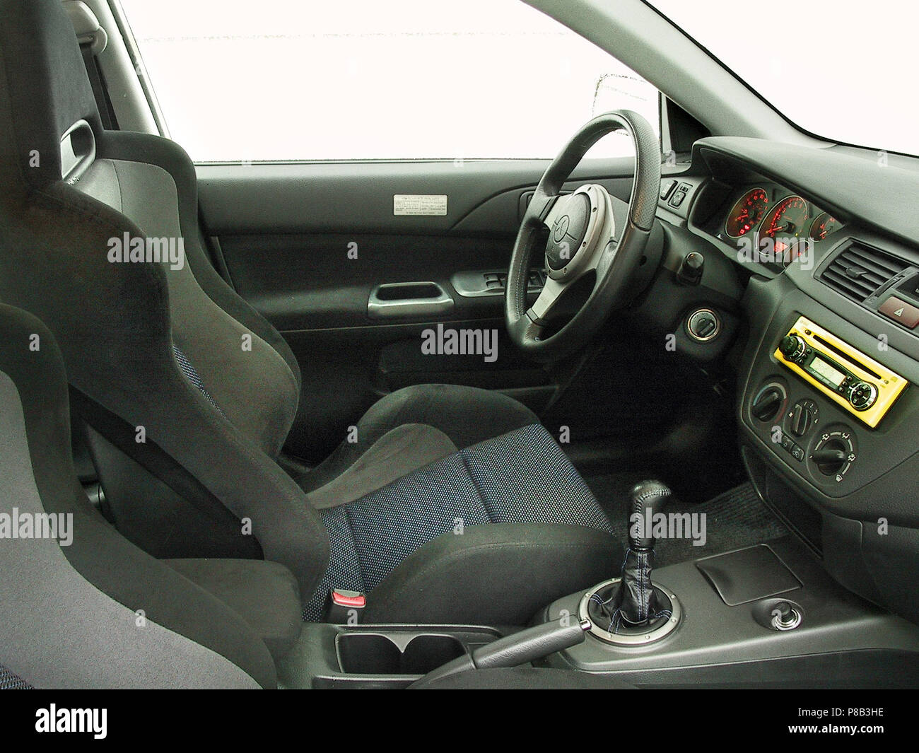 Mitsubishi Lancer Evolution 7 vii EVO - 2002 model in lightening yellow  colour - showing seating and interior Stock Photo - Alamy